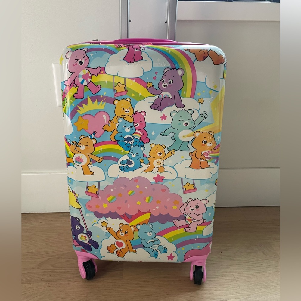Care bear rolling Cary on suitcase 💗💖